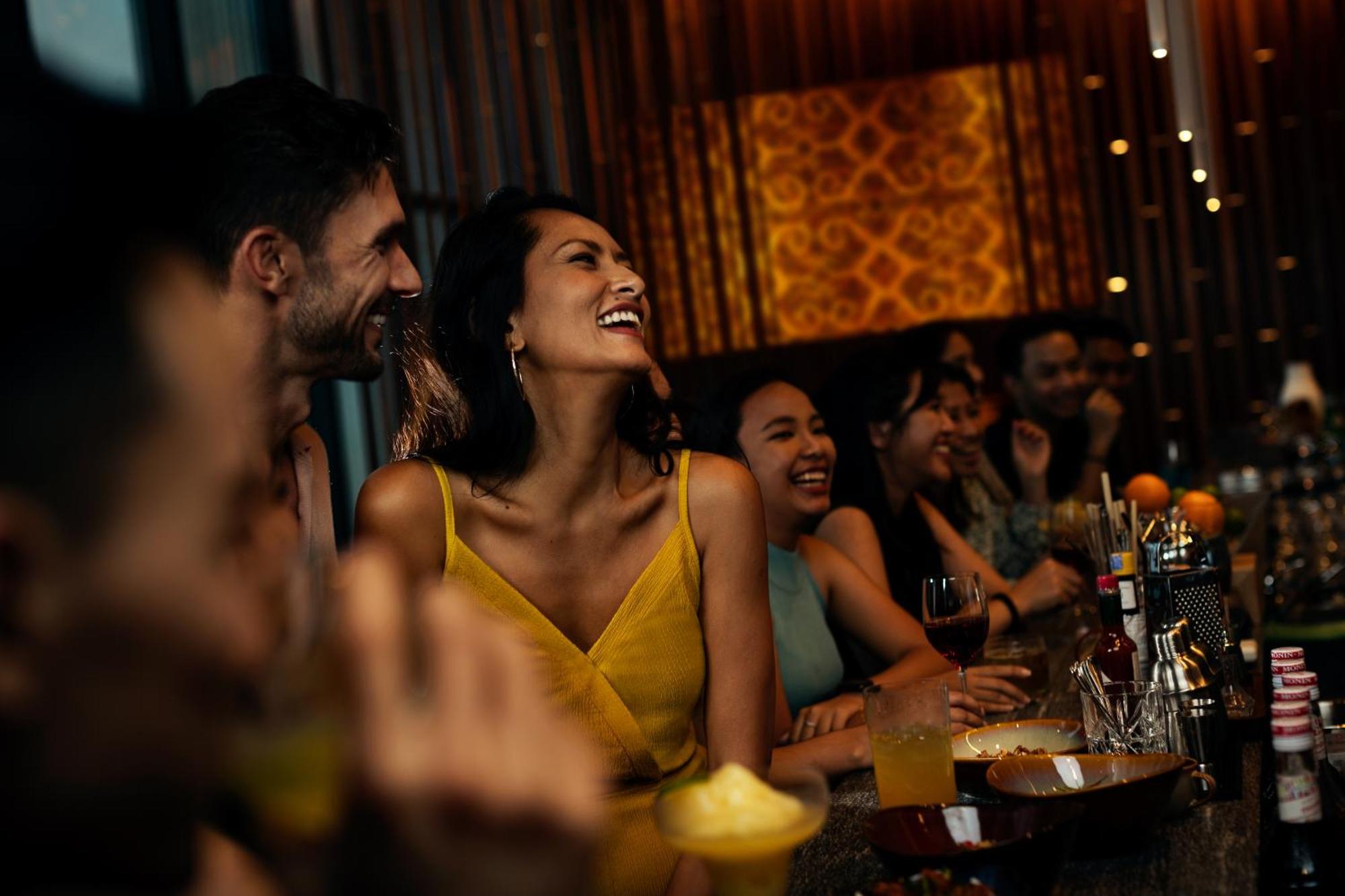 Hyatt Centric Kota Kinabalu Hotel Ngoại thất bức ảnh A woman laughing with friends